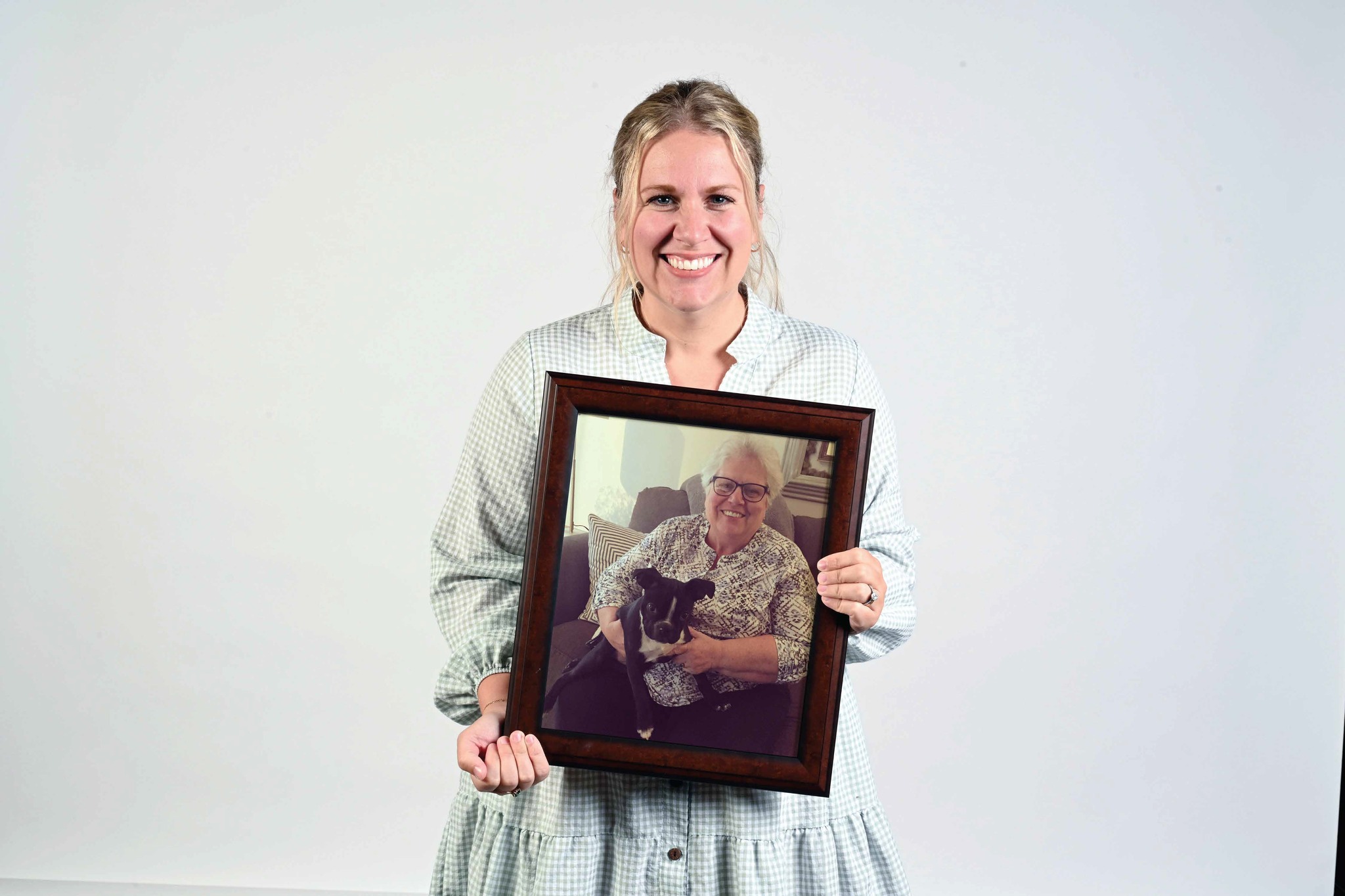 Woman holding photo of donor father